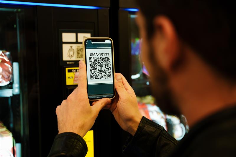 User scanning QR code with a mobile phone