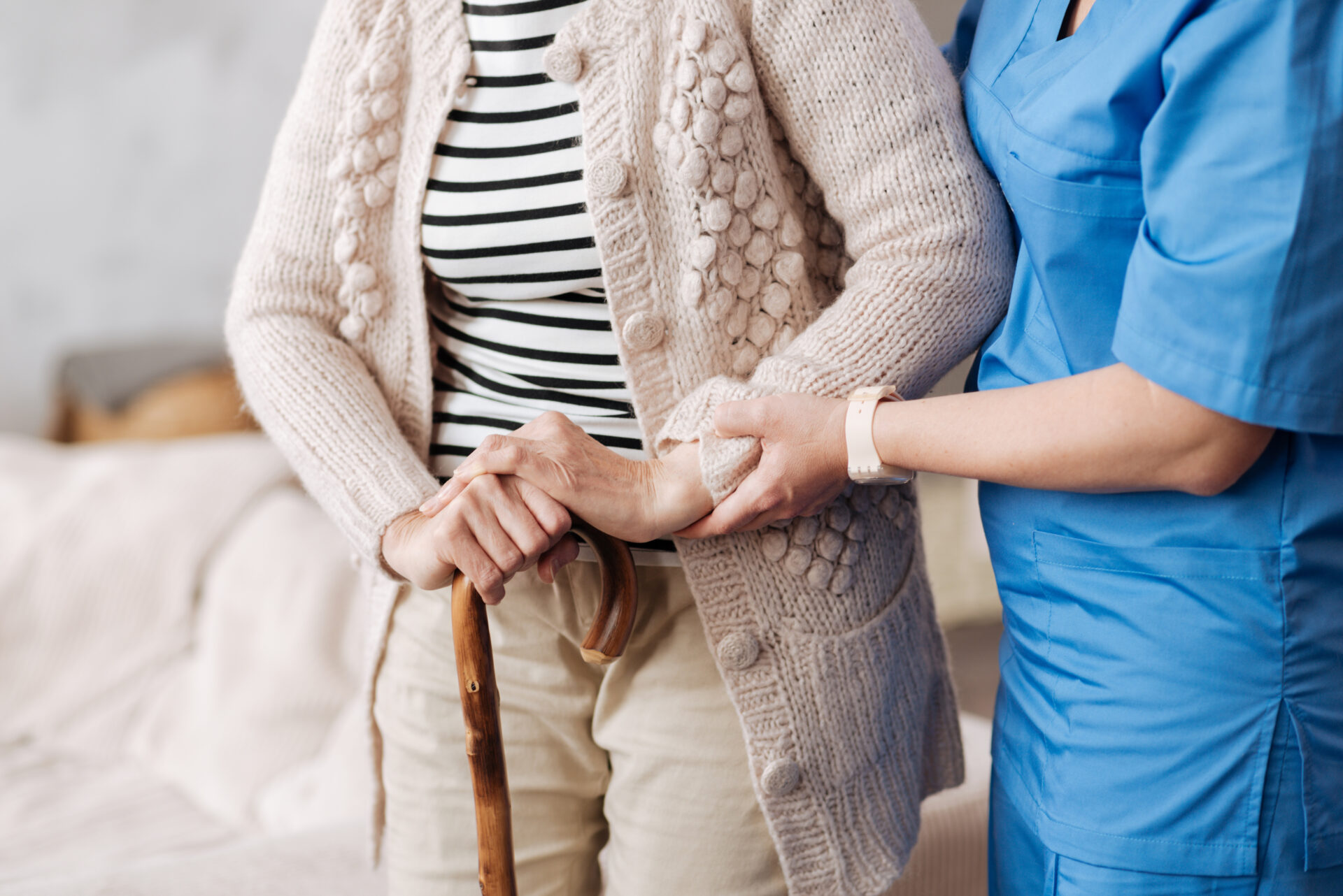 A trained support worker helping senior patient