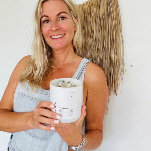 A happy person holding a cup of goodies