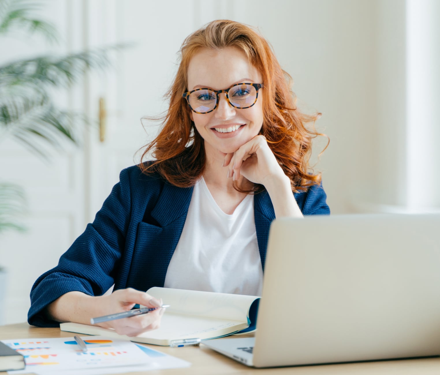An finance and account specialist with a laptop at her desk