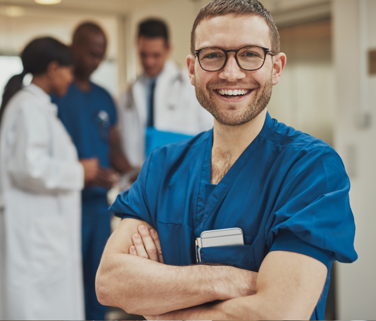 A nurse stands in a hospital, conveying care and professionalism.
