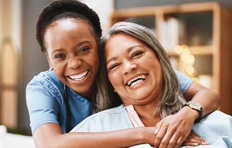 A support worker with an older woman, conveying compassion